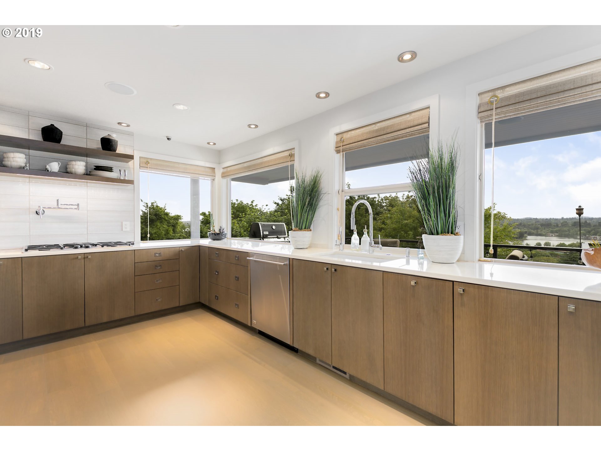6534 Southwest View Point Terrace Portland, OR 97239 - Photo 9 of 29 a kitchen with stainless steel appliances a sink and a large window
