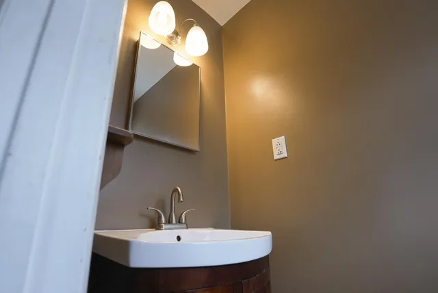 a bathroom with a sink and a mirror