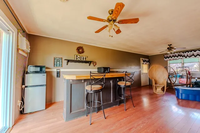 a view of a livingroom with furniture and a window