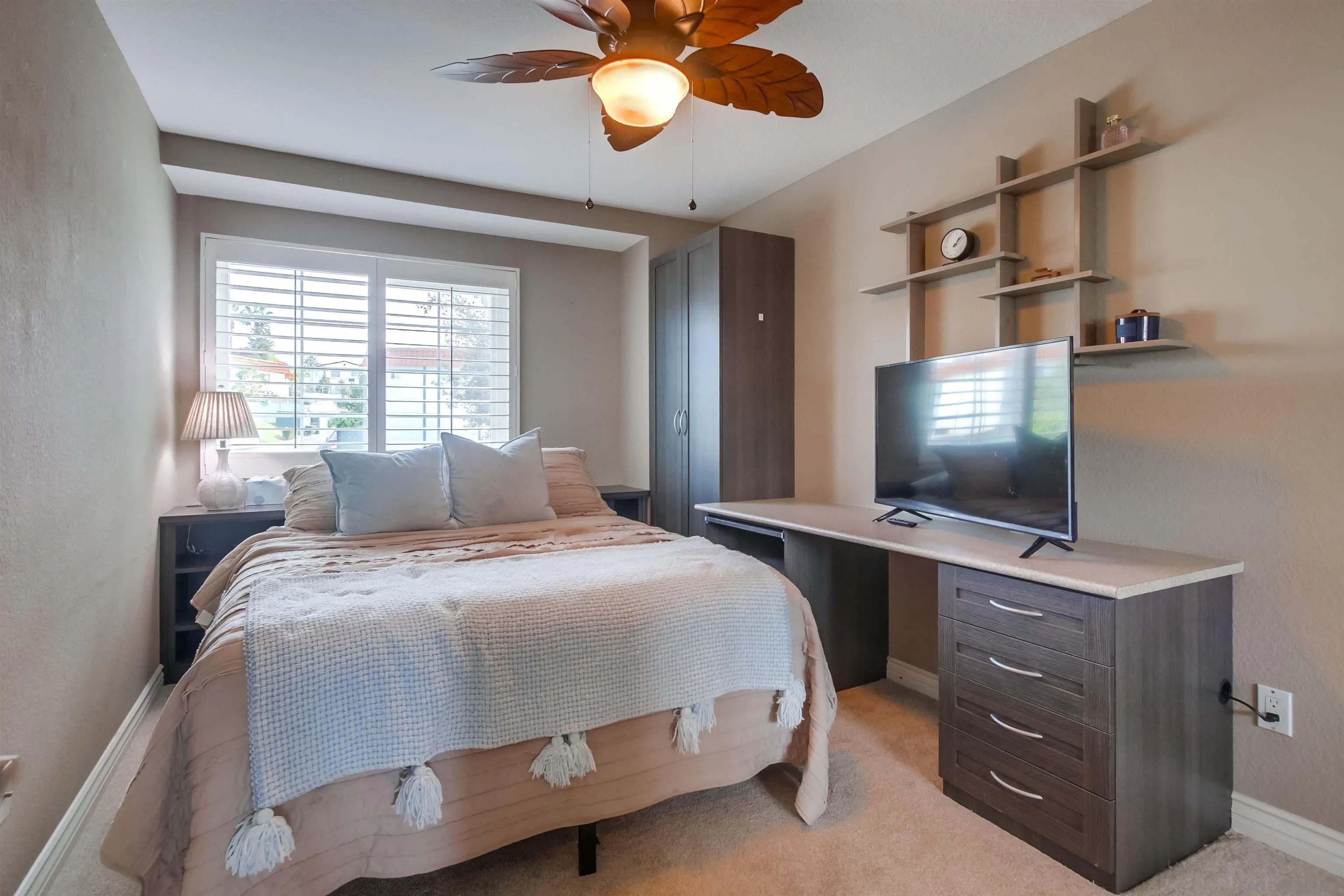 930 Gardena Road Encinitas, CA 92024 - Photo 19 of 27 a bedroom with a bed and a flat screen tv