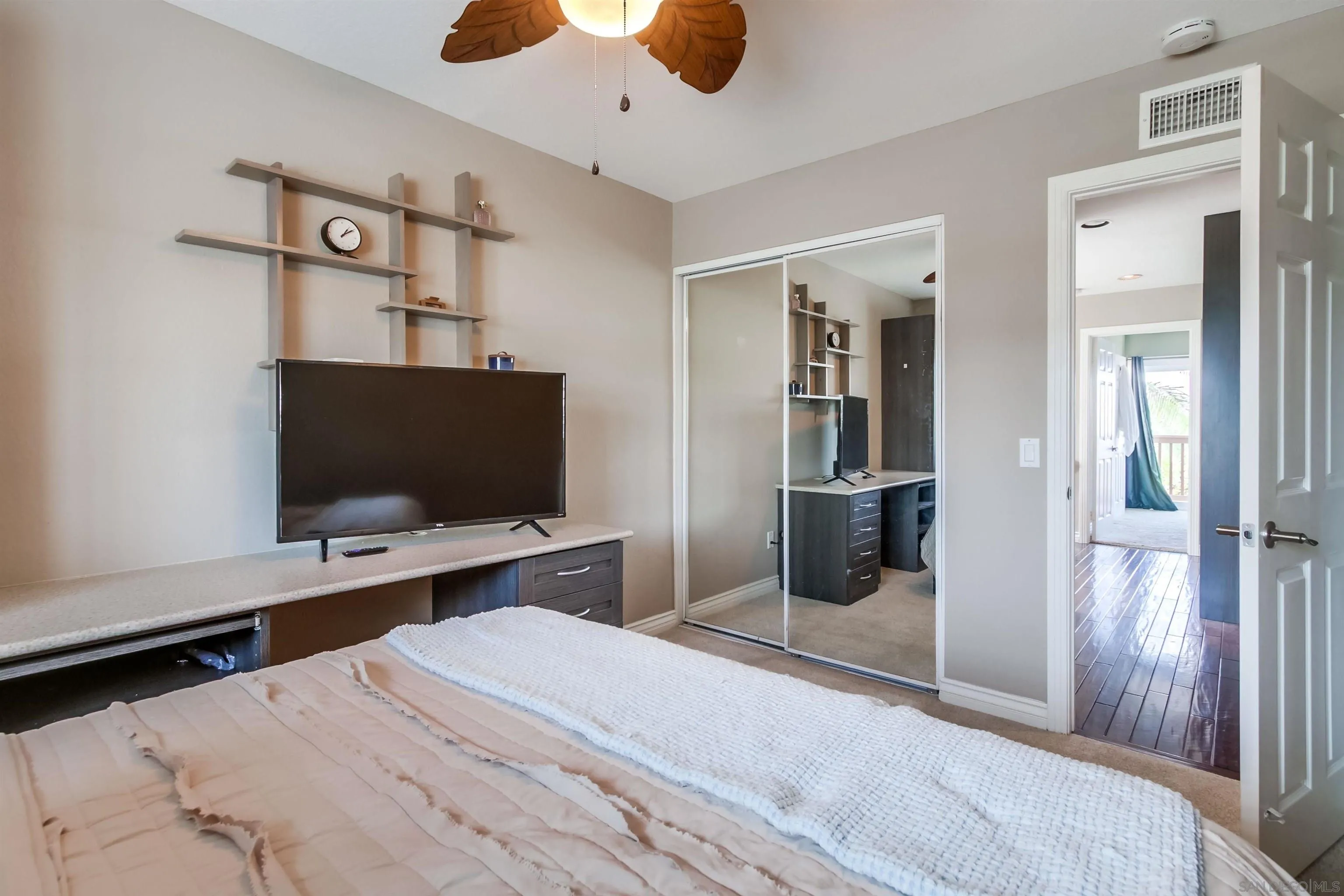 930 Gardena Road Encinitas, CA 92024 - Photo 20 of 27 a bedroom with a bed and a flat screen tv