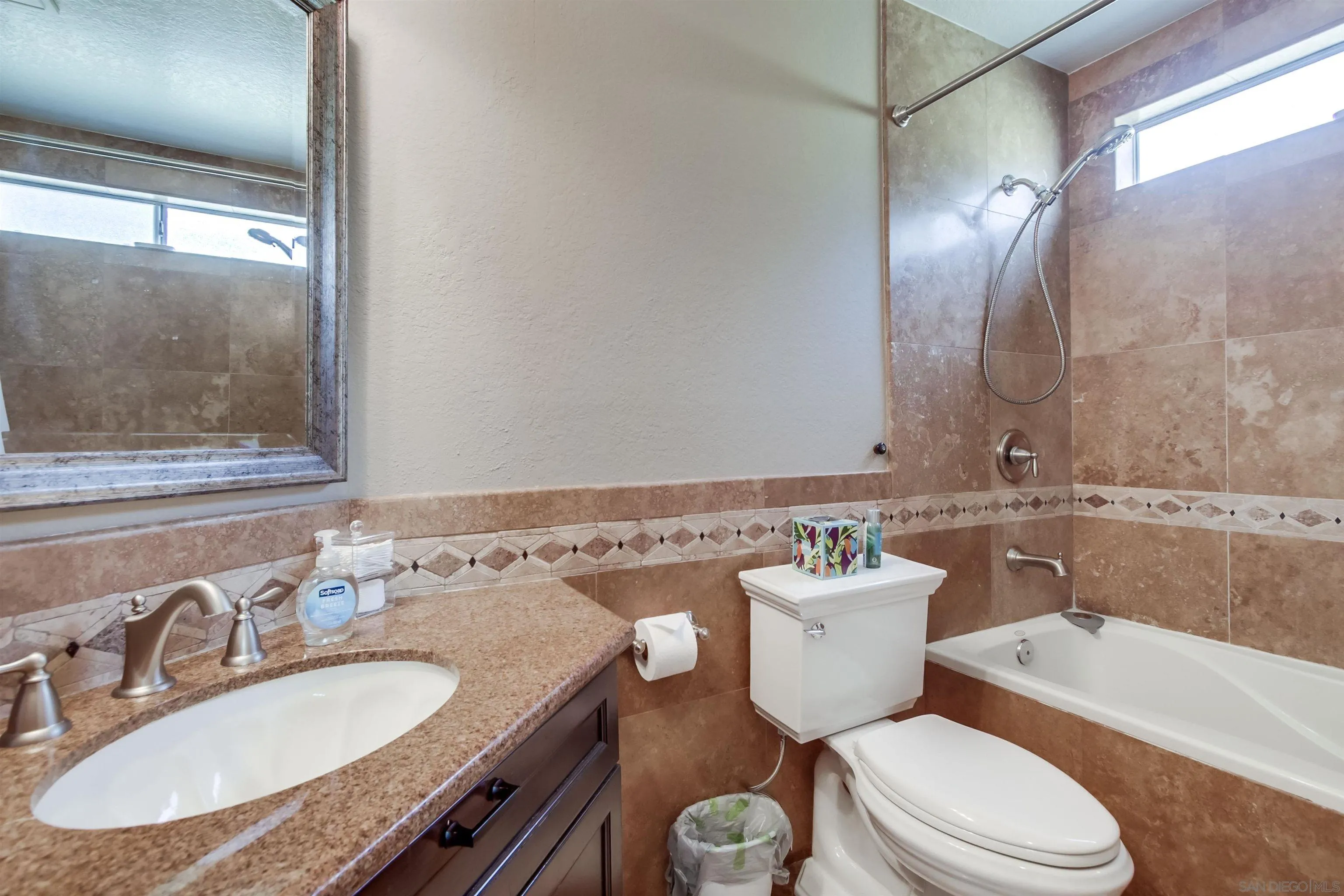 930 Gardena Road Encinitas, CA 92024 - Photo 21 of 27 a bathroom with a granite countertop toilet sink and mirror