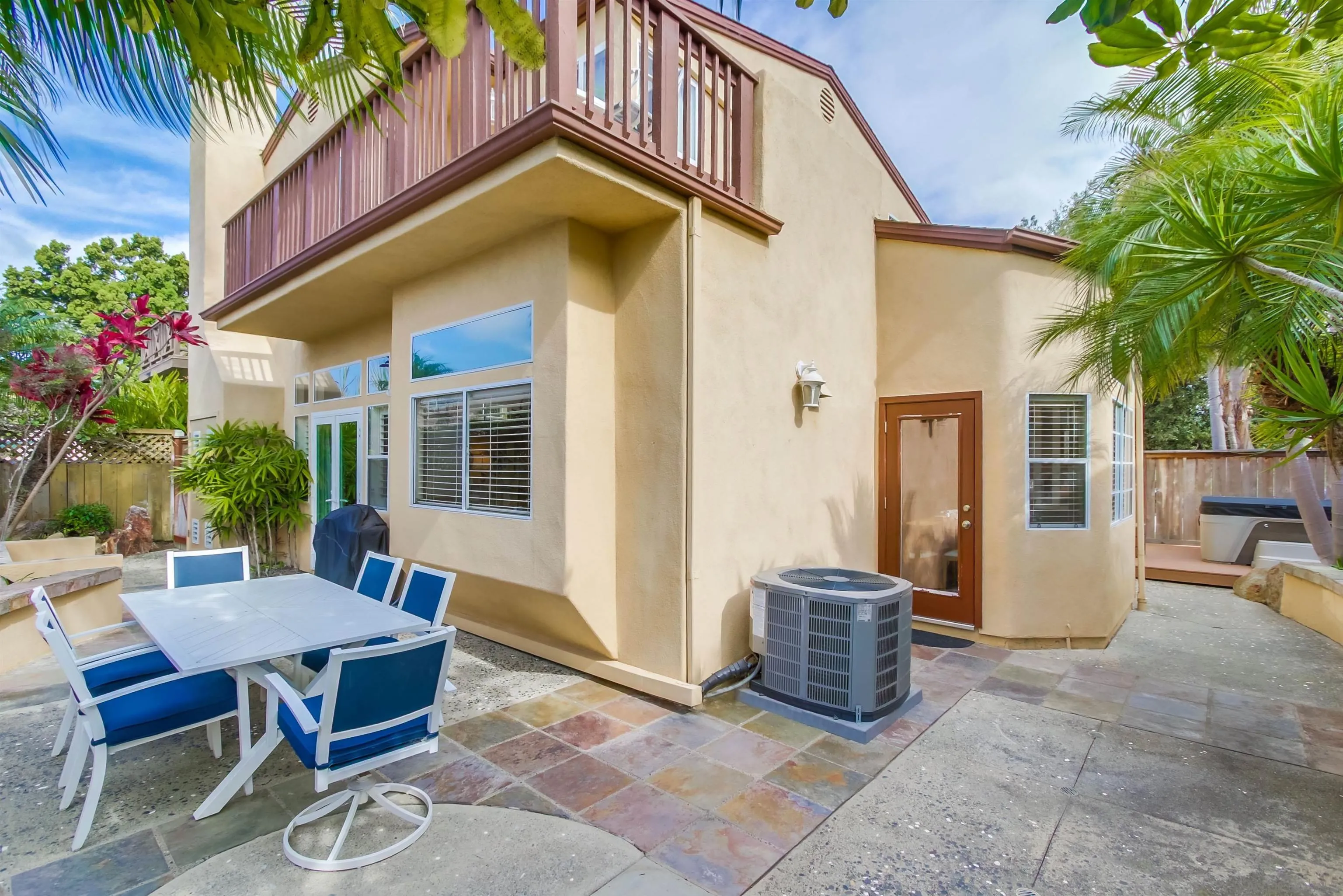 930 Gardena Road Encinitas, CA 92024 - Photo 24 of 27 a view of a patio with a table and chairs and potted plants