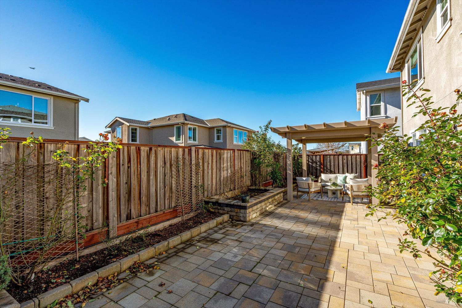 2560 Red Willow Drive Santa Rosa, CA 95403 - Photo 62 of 62 a view of a brick house with many windows next to a yard