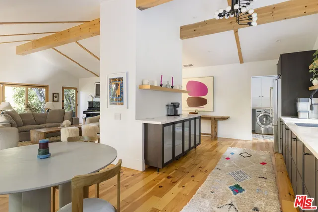 a kitchen with sink cabinets and stove
