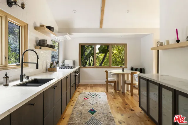 a bathroom with a sink toilet and mirror