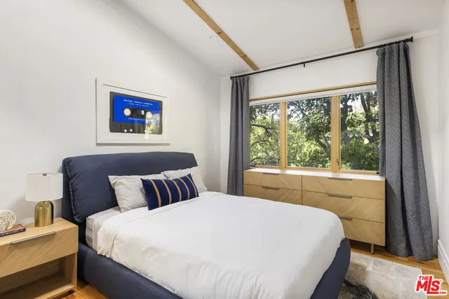 a bathroom with a double vanity sink mirror and shower