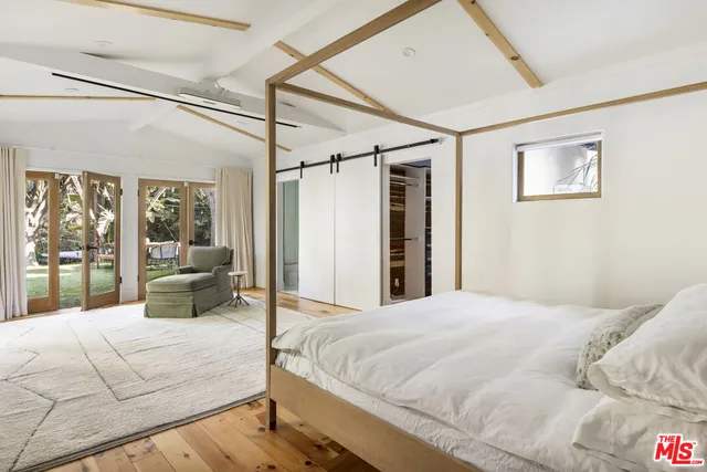 a kitchen with stainless steel appliances granite countertop a sink and a refrigerator