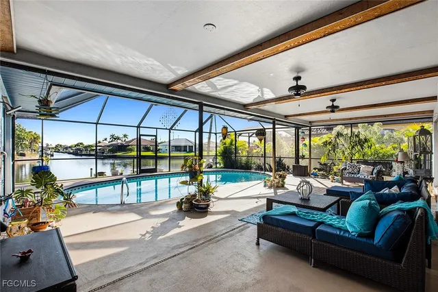 a living room with furniture a clock and a window