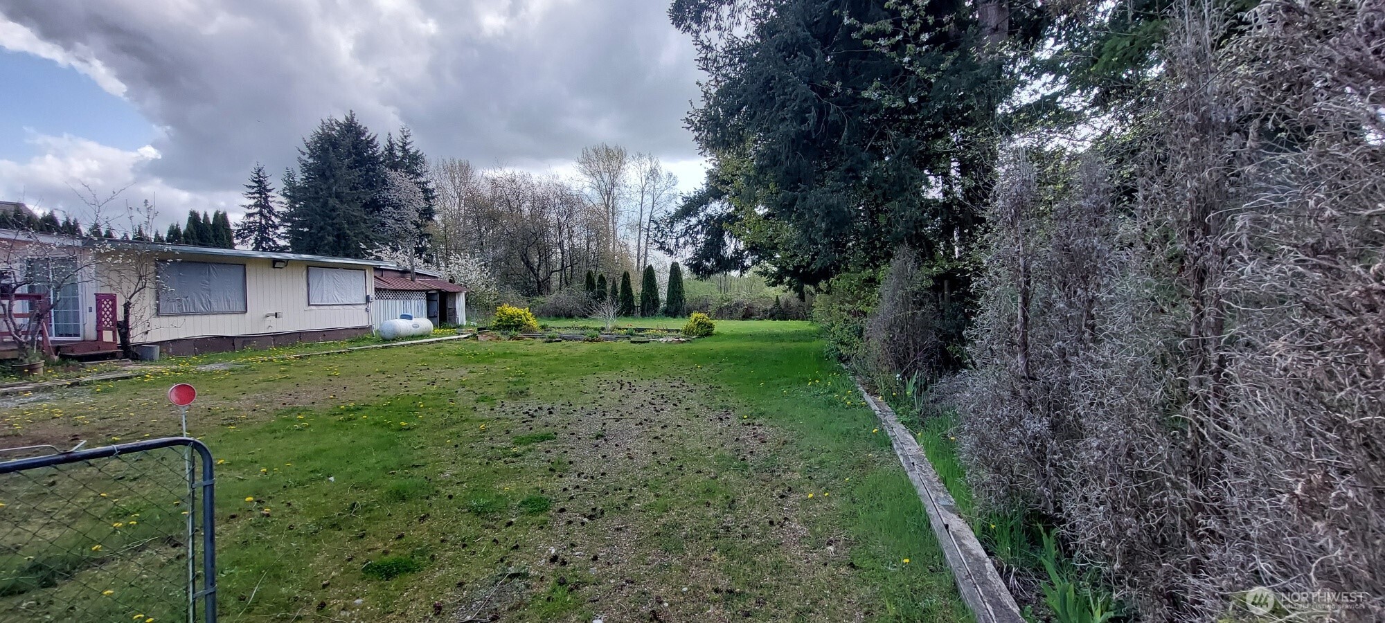 3051 Main Street Custer, WA 98240 - Photo 2 of 12 a view of an house with backyard space and garden