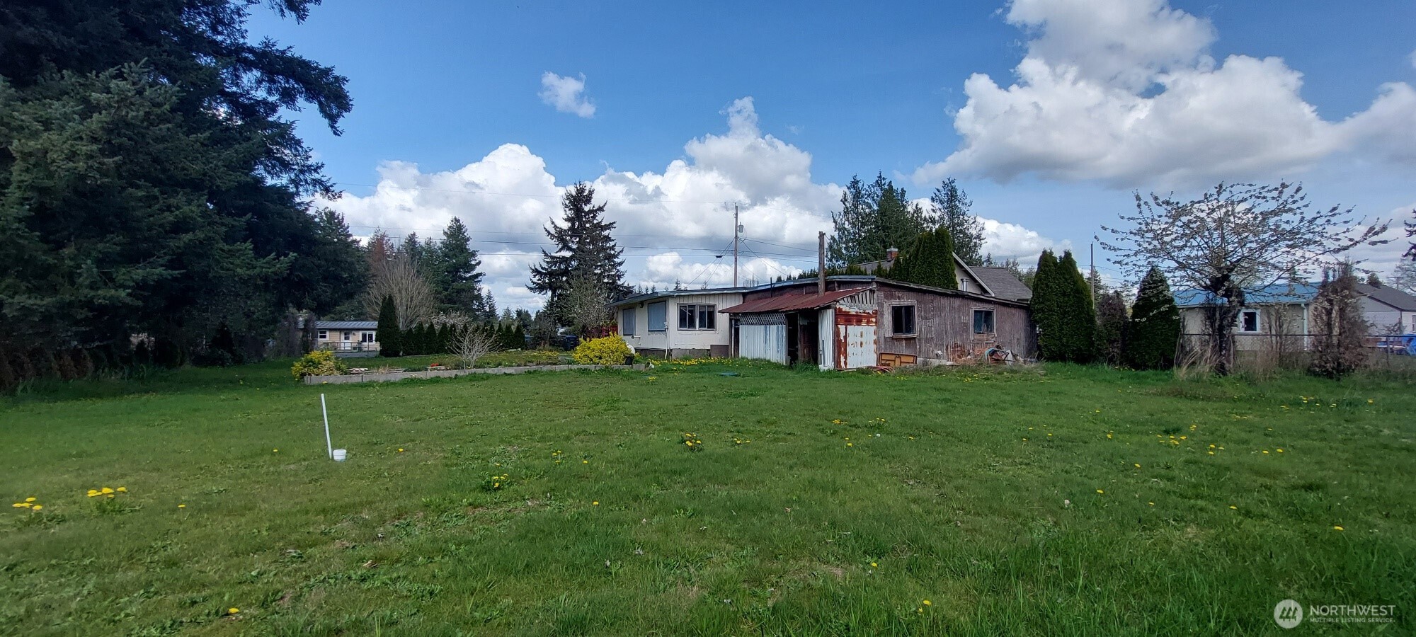 3051 Main Street Custer, WA 98240 - Photo 5 of 12 a view of a house with a big yard and a fountain