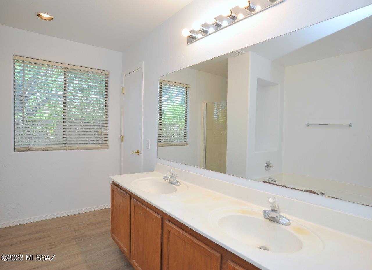 4543 South Valley Road Tucson, AZ 85714 - Photo 24 of 41 a bathroom with a sink and a mirror