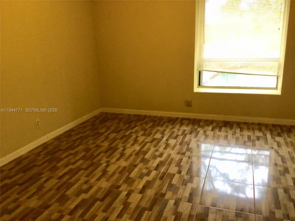 a view of an empty room and window