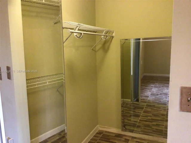 a bathroom with a glass door shower