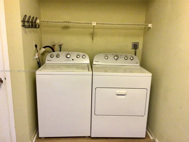a utility room with dryer and washer