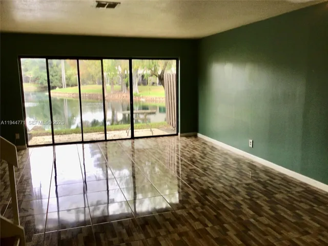 a view of an empty room and window