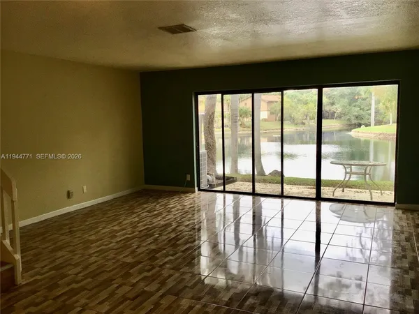 a view of an empty room and window
