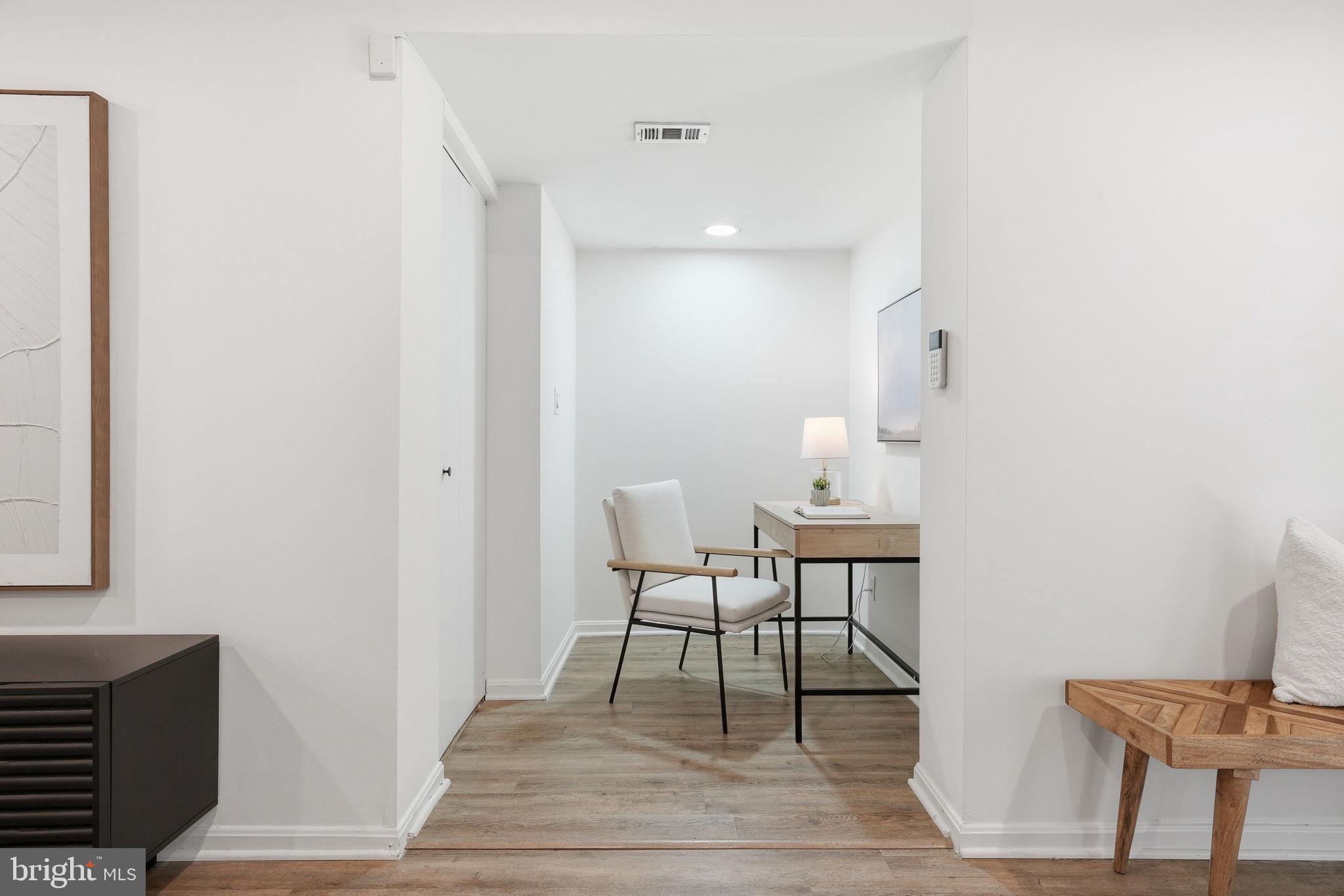 1200 East Capitol Street Northeast, Unit 1 Washington, DC 20002 - Photo 10 of 31 a view of a dining room with furniture and wooden floor