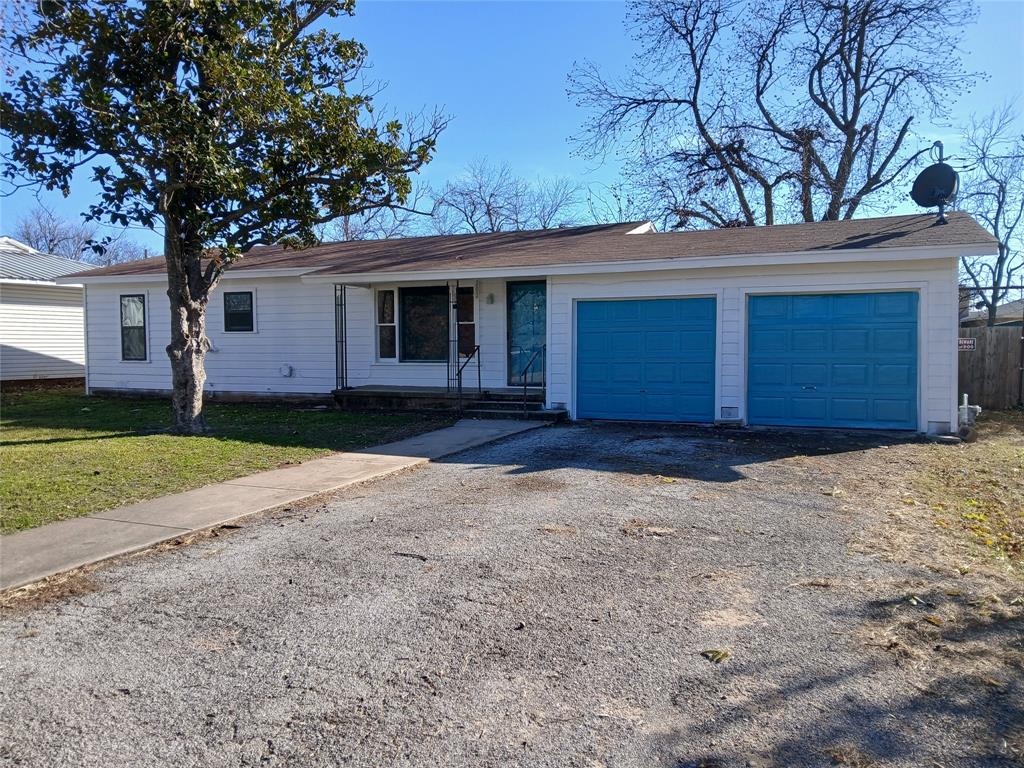 202 Roselawn Street Coleman, TX 76834 - Photo 1 of 1 a house with a tree in front of it