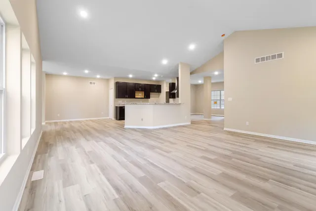 a view of a kitchen with a sink and a microwave