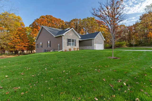 front view of a house with a yard