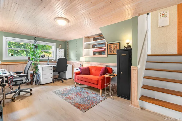 a bedroom with furniture and a window