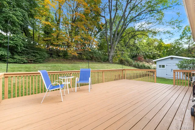 a view of balcony with deck and trees