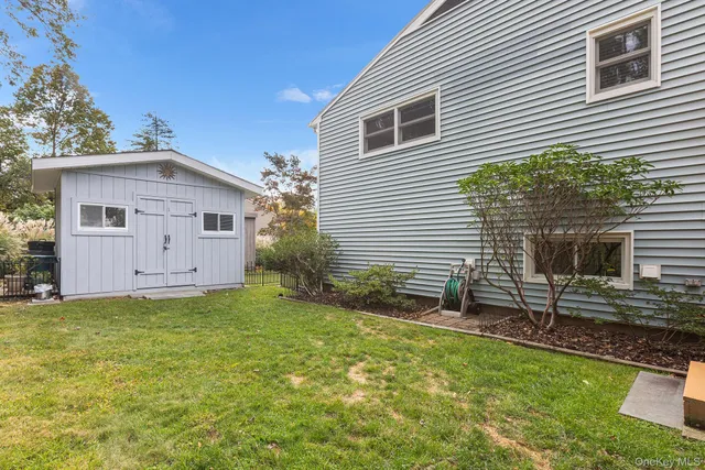 a house view with a backyard space