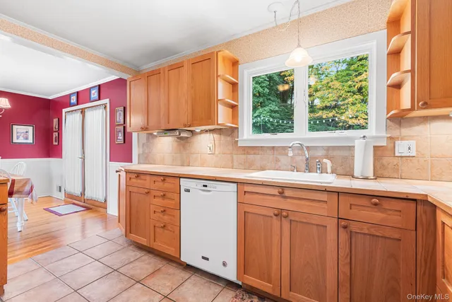 a kitchen with stainless steel appliances granite countertop a sink and a cabinets