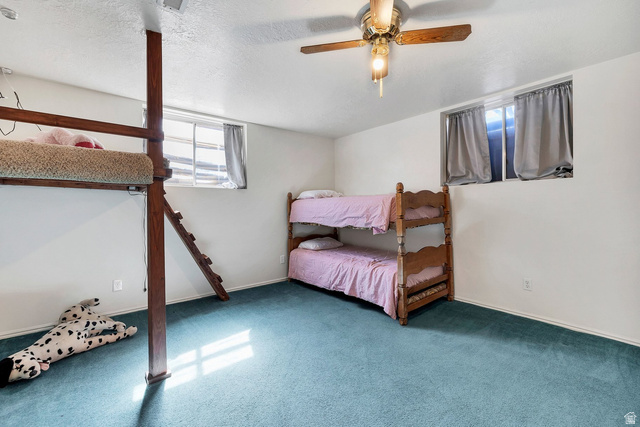 3334 Ute Road St. George, UT 84790 - Photo 31 of 40 Bedroom with a textured ceiling, ceiling fan, and carpet flooring