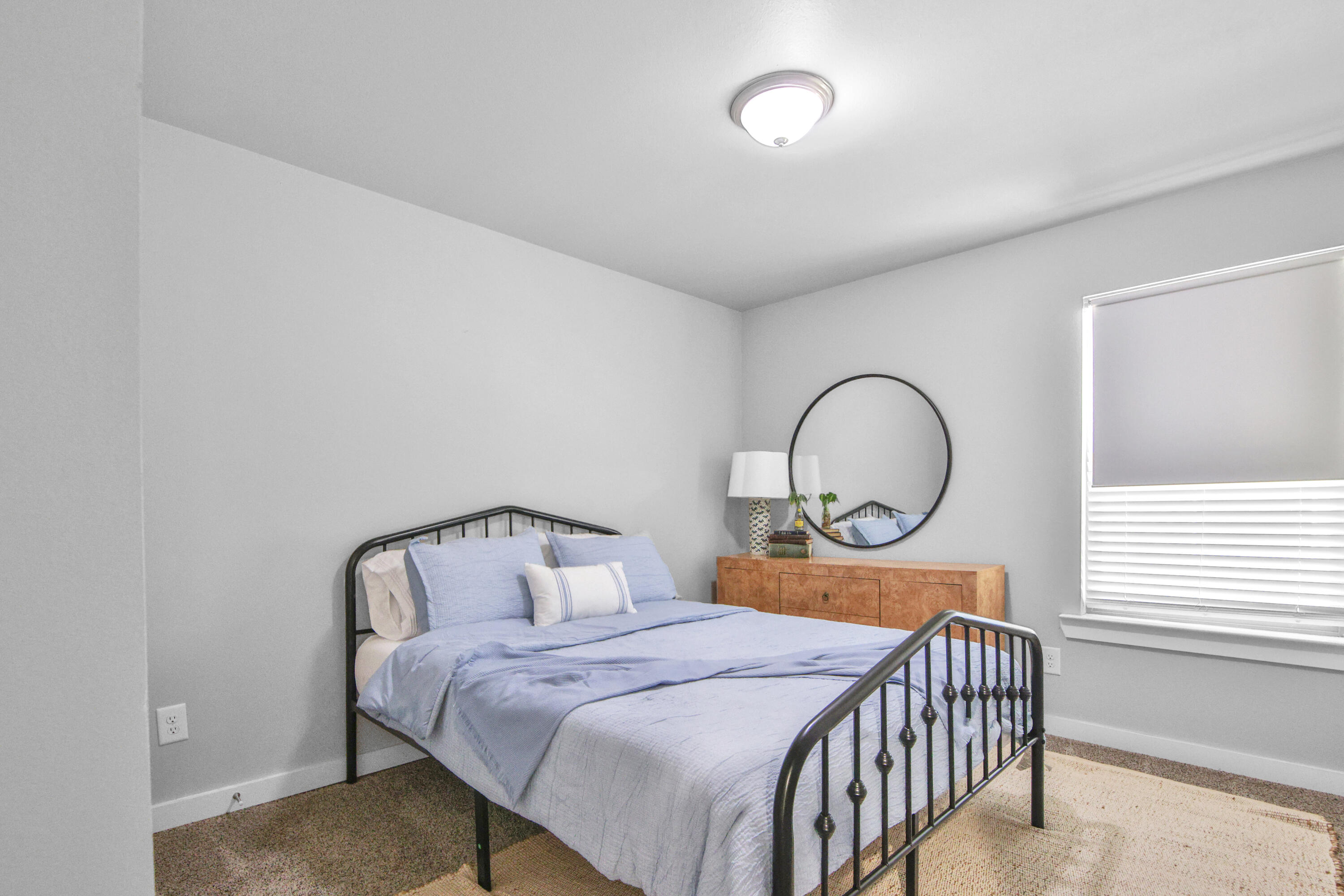 4613 126th Street Lubbock, TX 79424 - Photo 12 of 33 a bedroom with a bed and a window