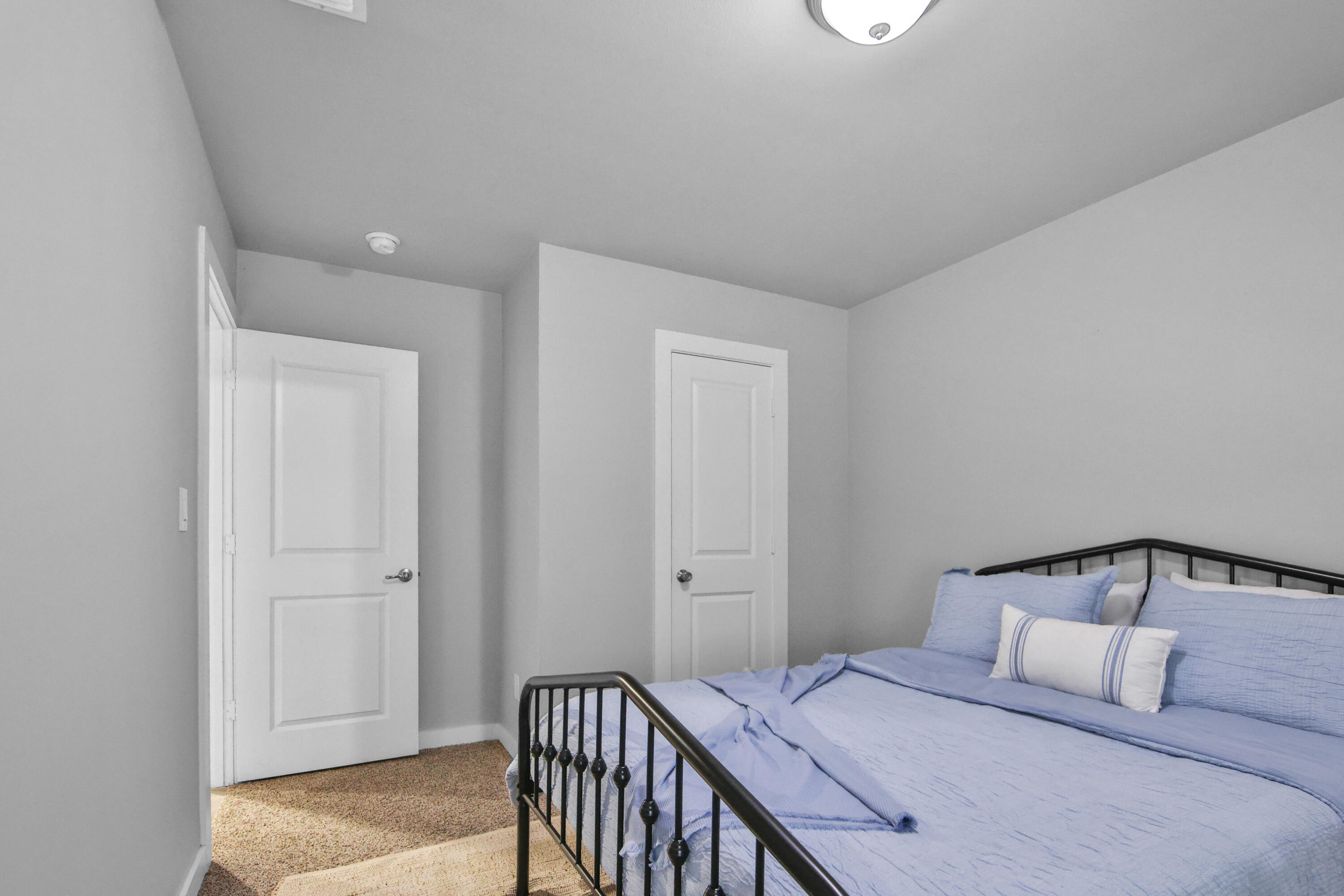 4613 126th Street Lubbock, TX 79424 - Photo 14 of 33 a bedroom with a bed and wooden floor