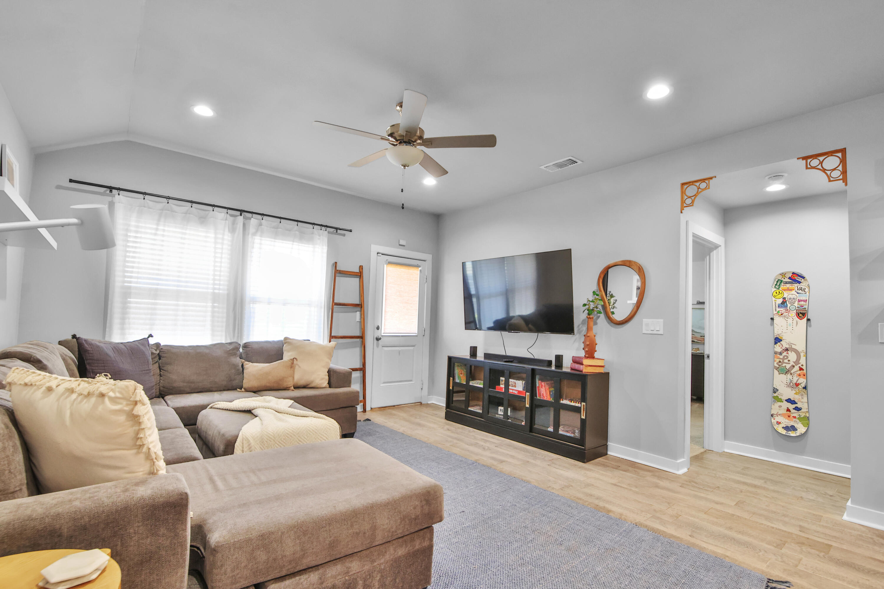 4613 126th Street Lubbock, TX 79424 - Photo 21 of 33 a living room with furniture and a flat screen tv