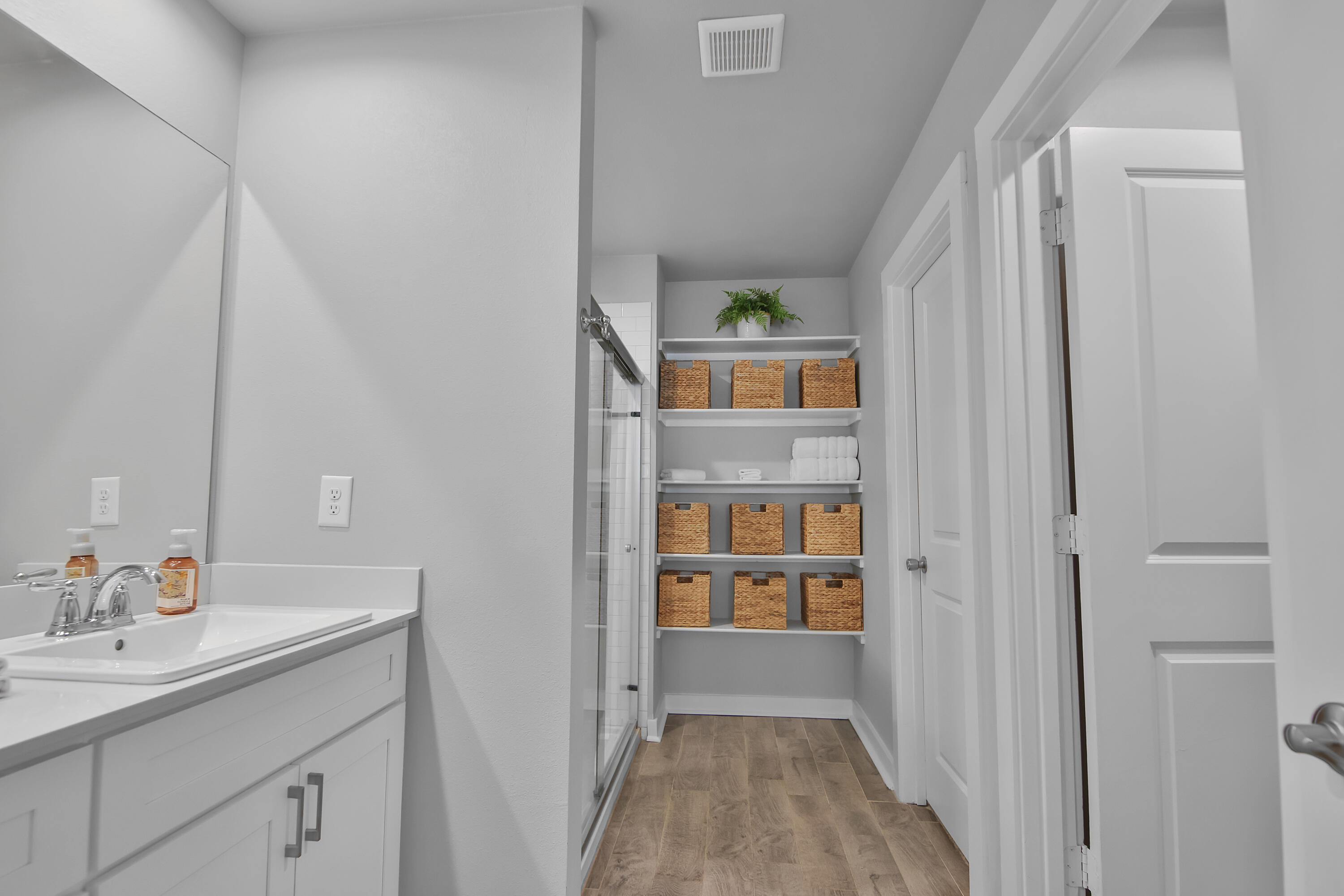 4613 126th Street Lubbock, TX 79424 - Photo 28 of 33 a bathroom with a sink and a mirror