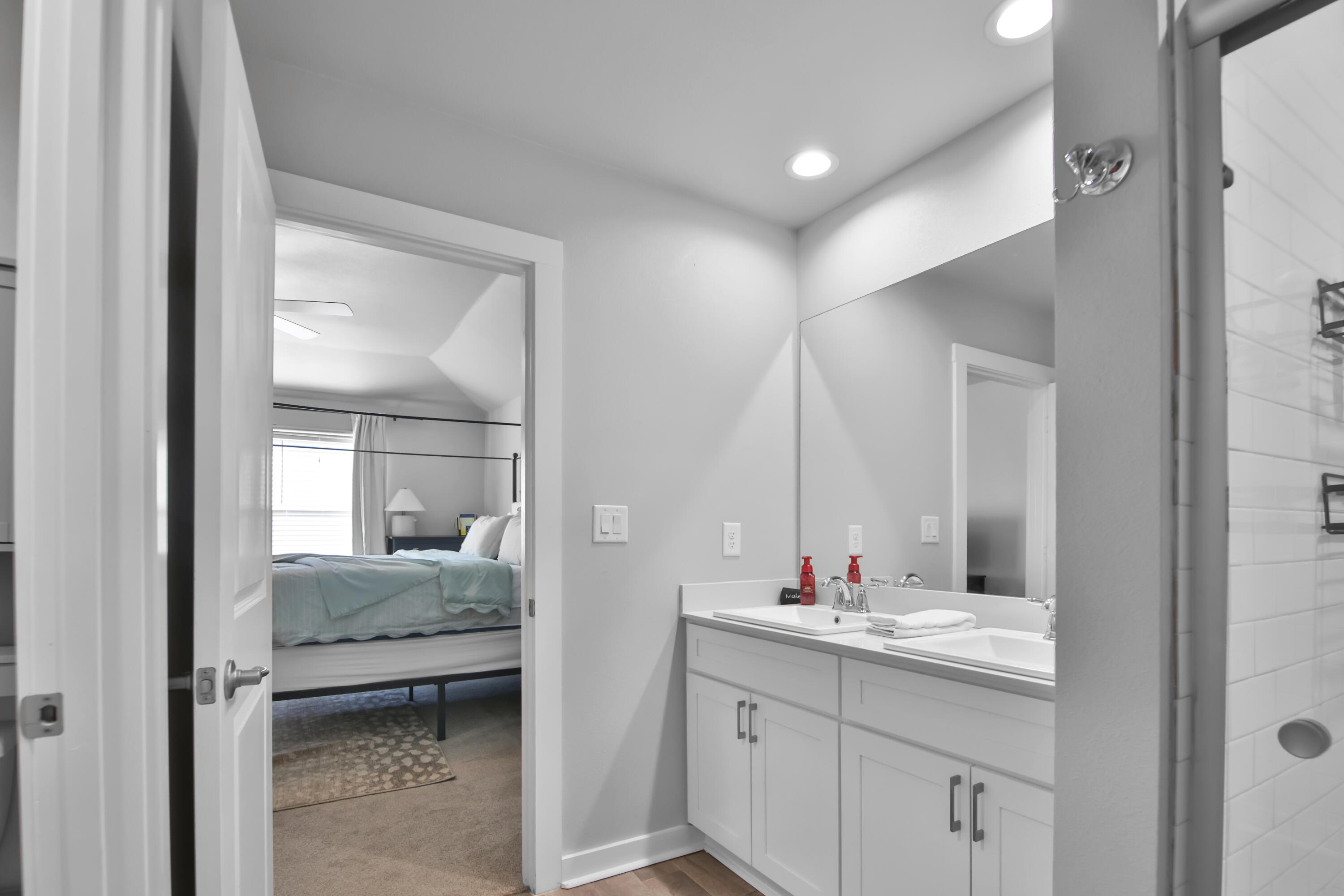 4613 126th Street Lubbock, TX 79424 - Photo 30 of 33 a en suite bathroom with a granite countertop sink and a mirror