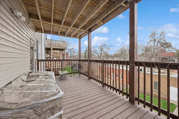 a view of a balcony with wooden floor
