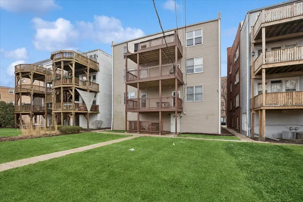 a large building with a yard in front of it