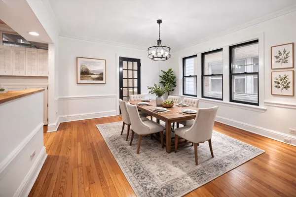 a view of a dining room with furniture window and wooden floor