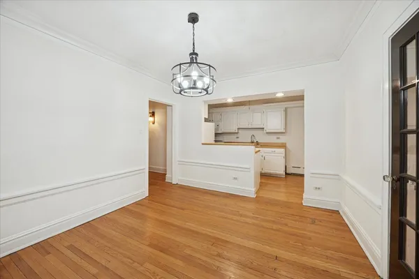 a kitchen with stainless steel appliances a refrigerator and microwave