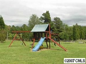 4870 Old Sapp Road Kannapolis, NC 28025 - Photo 5 of 8 a view of a park with a slide
