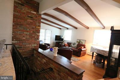6429 Lignum Street Springfield, VA 22150 - Photo 9 of 29 a living room with furniture wooden floor and a flat screen tv