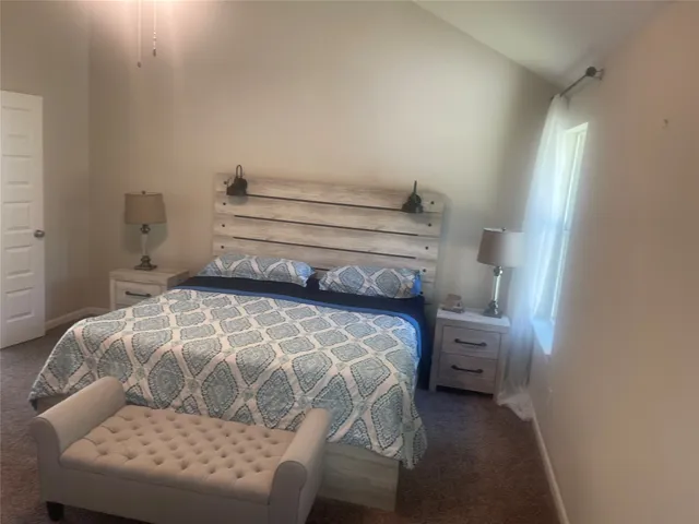 a bedroom with a bed and a cabinets