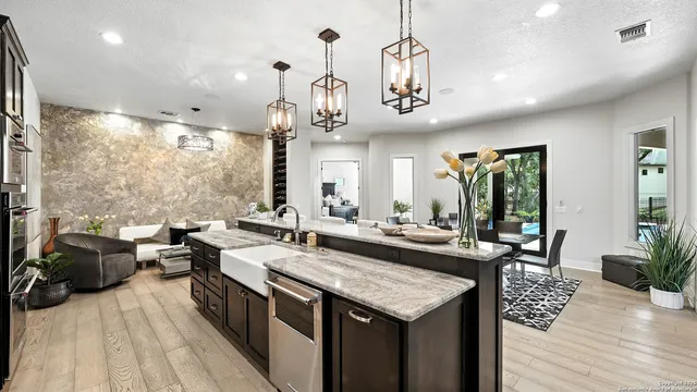 a large kitchen with a table and chairs