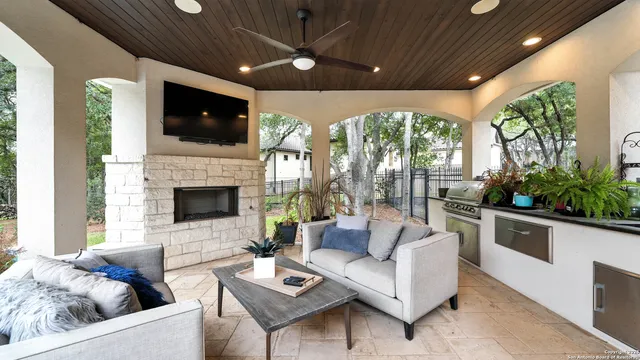 a living room with furniture fireplace and flat screen tv