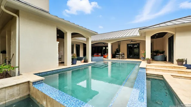 a view of a house with a swimming pool