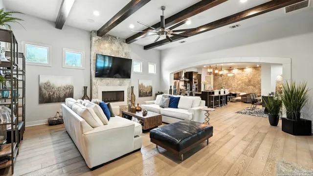 a living room with furniture fireplace and a flat screen tv