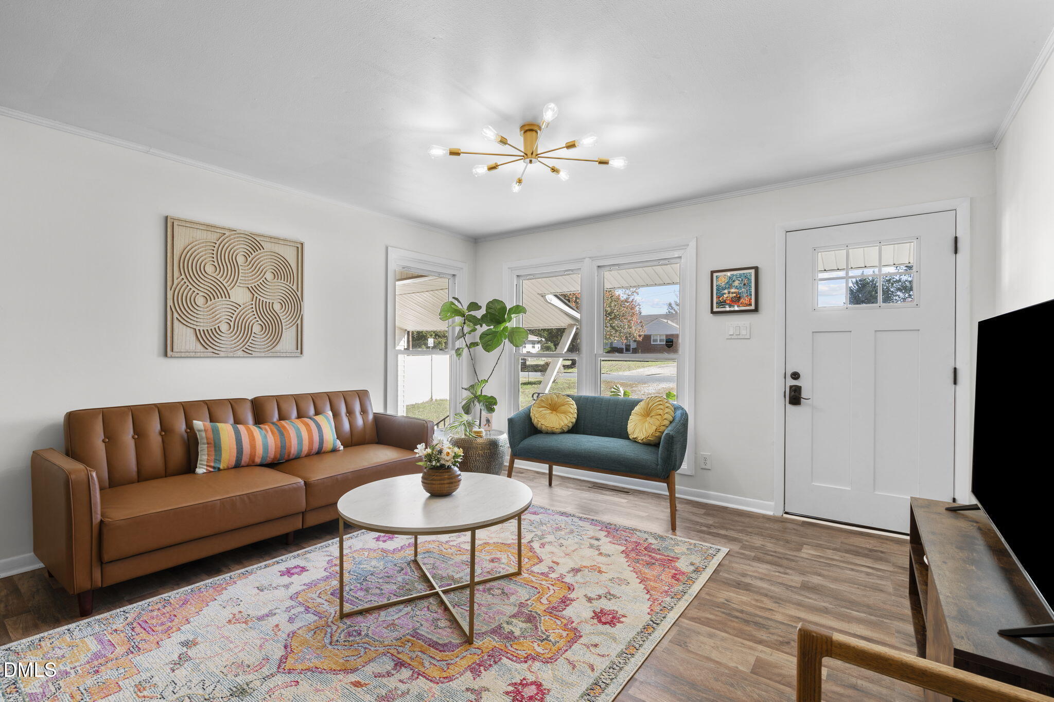 3307 Winston Road Durham, NC 27704 - Photo 10 of 22 a living room with furniture a flat screen tv and a window