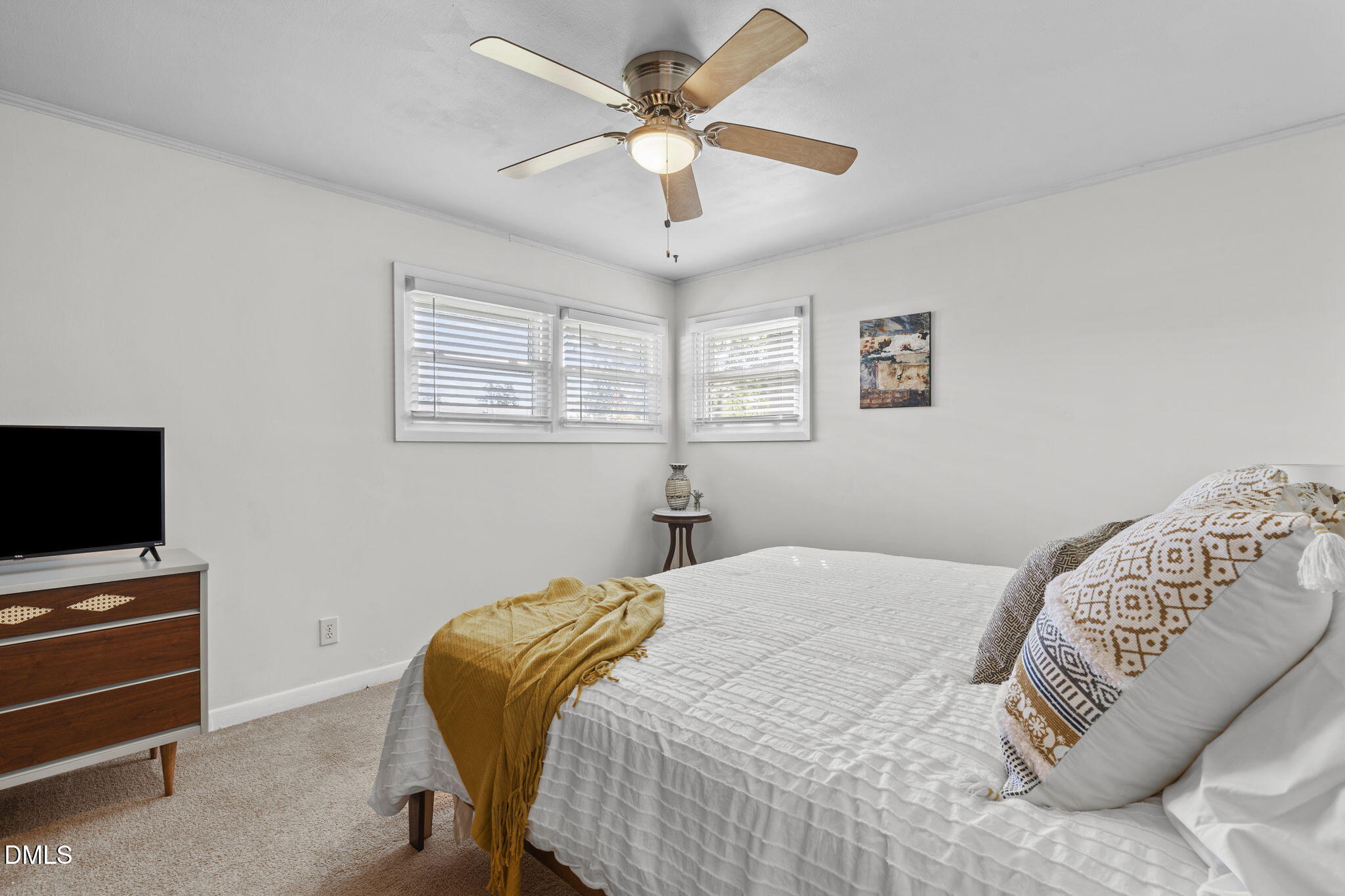 3307 Winston Road Durham, NC 27704 - Photo 13 of 22 a bedroom with a bed and a chandelier