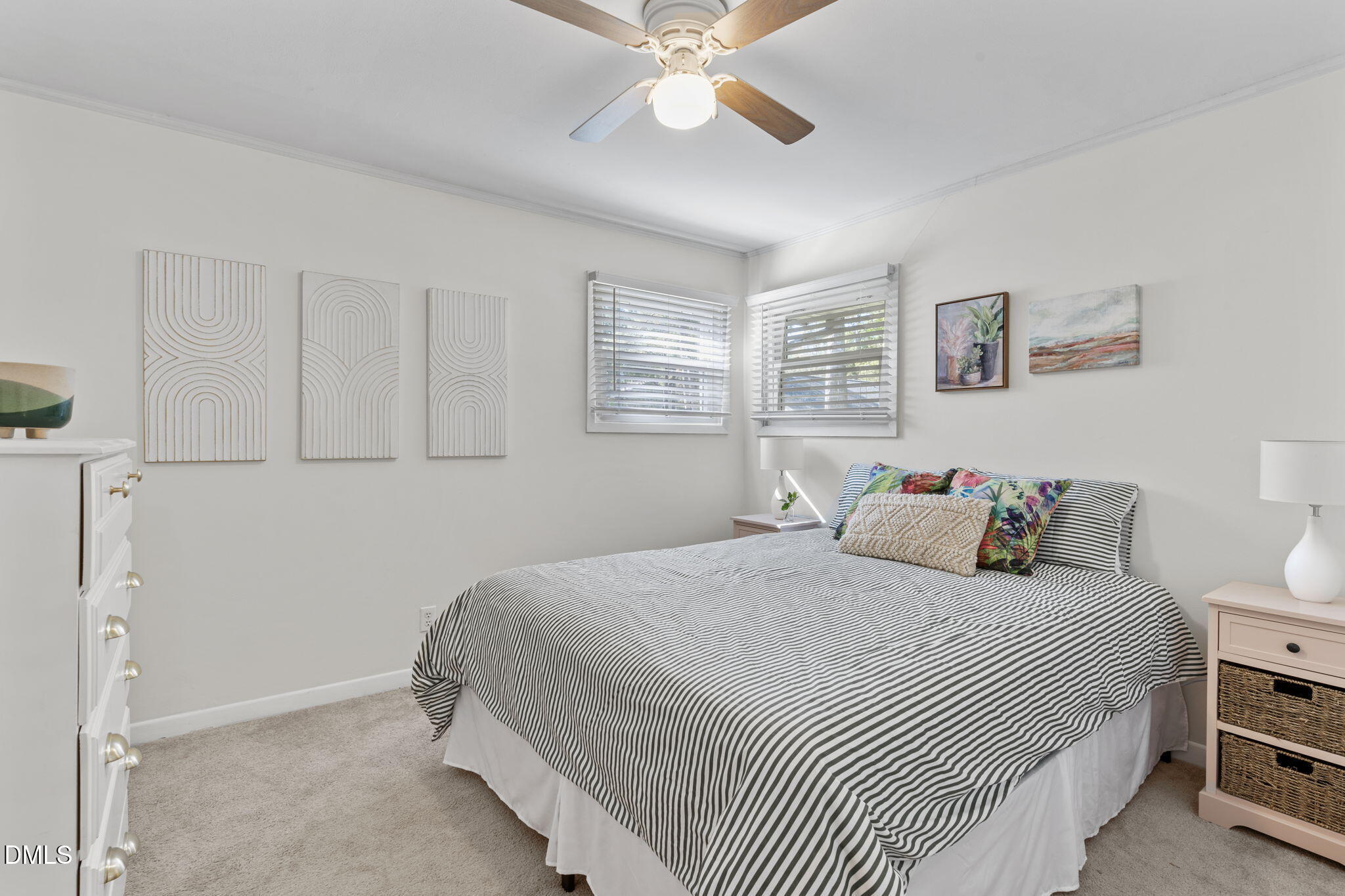 3307 Winston Road Durham, NC 27704 - Photo 15 of 22 a bedroom with a large bed and a chandelier
