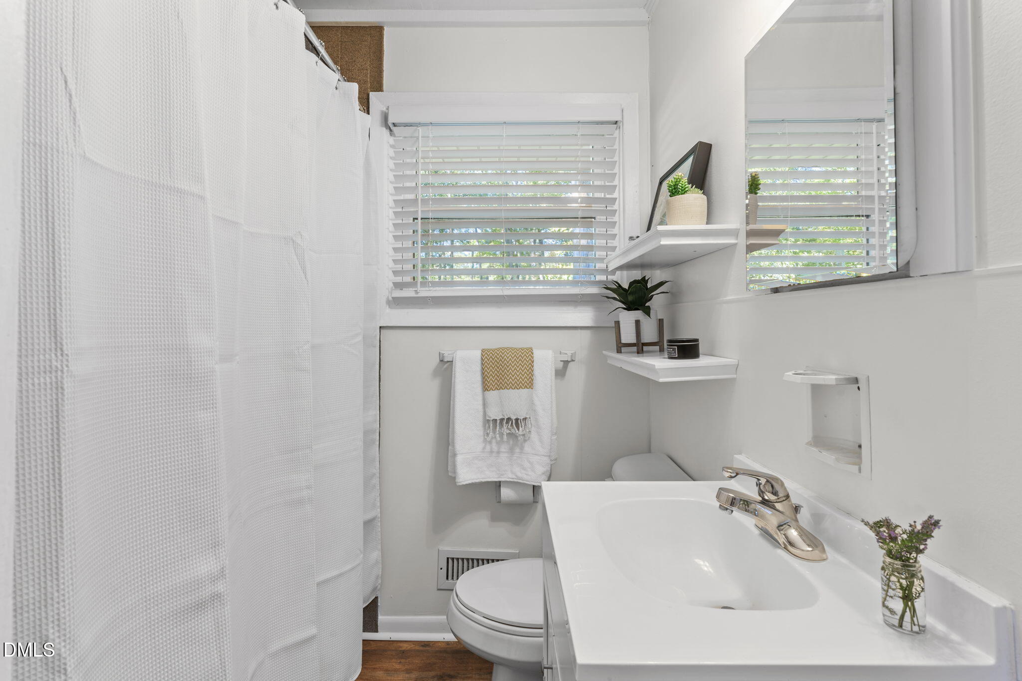3307 Winston Road Durham, NC 27704 - Photo 17 of 22 a bathroom with a sink and a toilet